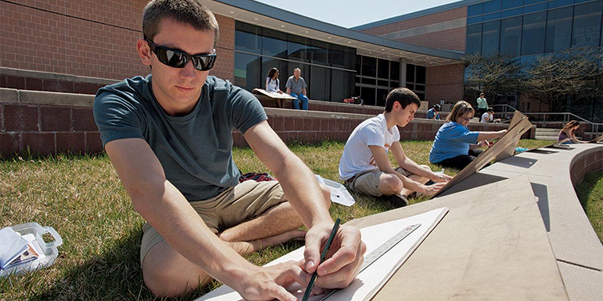 AACC art student draws outdoors.